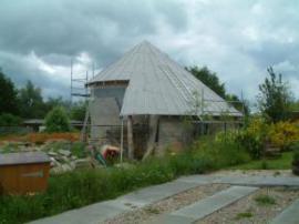 Findhorn, house with a conical spiral roof, must go back and see it finished